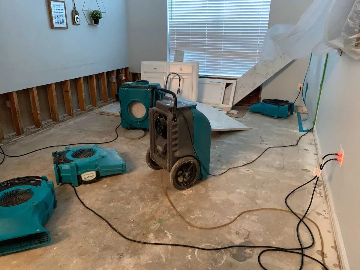 Dehumidifier in flood-cut room for Water Damage Restoration in Cary